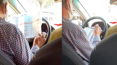 Araç kullanırken at yarışı oynayan taksici bu kadarına da pes dedirtti