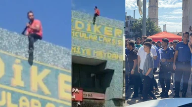 İş yerinin açılması için çatıya çıkıp tüfekle ateş açtı!